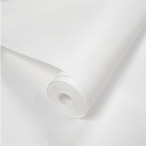May include: A roll of white wallpaper, partially unrolled, revealing the inner core. The paper has a smooth, matte finish. The image is a close-up, highlighting the texture and color of the wallpaper.