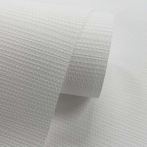 May include: White textured wallpaper roll with a subtle grid pattern. The wallpaper is rolled up and the end of the roll is visible.