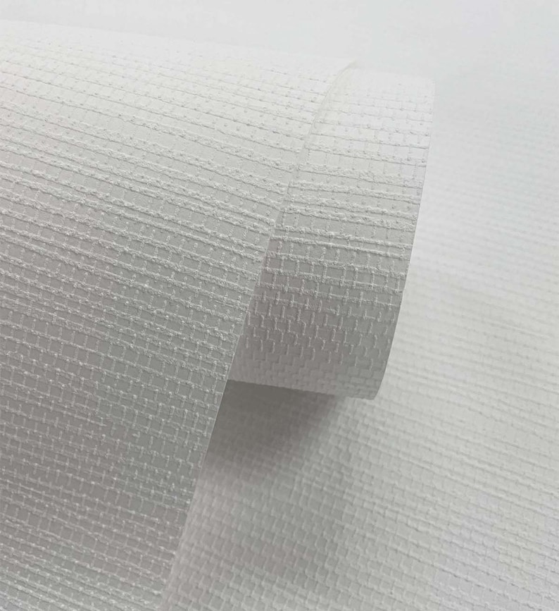 May include: White textured wallpaper roll with a subtle grid pattern. The wallpaper is rolled up and the end of the roll is visible.