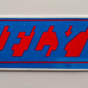 FLY - Blue Background with RED Digital Letters on White Porcelain.