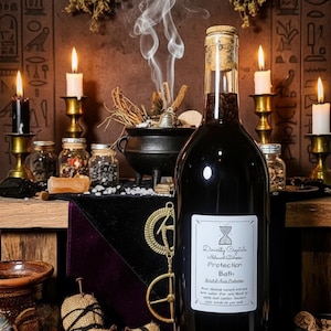 May include: A dark bottle with a cork stopper and a label reading "Divinity Crystals Protection Bath" sits on a wooden surface. The scene includes candles, a cauldron, a voodoo doll, and dried herbs, creating a mystical ambiance.