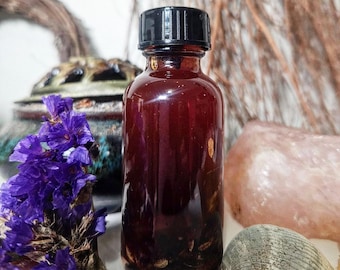 Aceite Hoodoo (Muladhara) estimulante del chakra raíz: conexión a tierra, estabilidad, fuerza, seguridad, poder ancestral y protección espiritual.