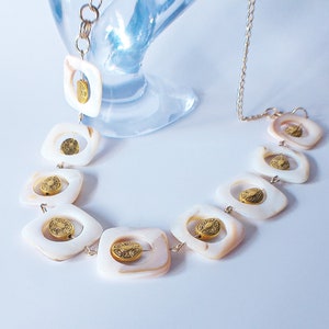 Mother of Pearl necklace and gold charm necklace