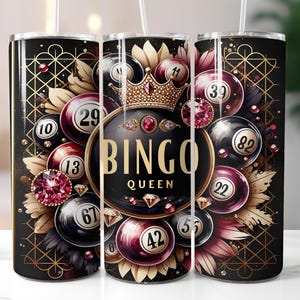 May include: A black tumbler with a gold geometric pattern and the words "BINGO QUEEN". The design includes bingo balls with numbers, a crown, and jewel accents. The tumbler is designed for cold beverages.
