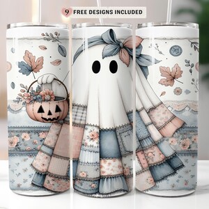 May include: A cylindrical tumbler featuring a white ghost character wearing a blue and pink floral patchwork dress and a matching bow. The design includes a pink jack-o'-lantern bucket filled with flowers, autumn leaves, and the text 9 FREE DESIGNS INCLUDED.