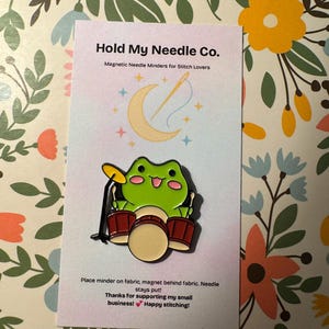 Frog Drummer Needle Minder – Fun Magnetic Needle Holder for Cross Stitch & Embroidery
