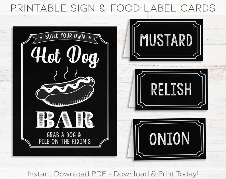 May include: Printable black and white sign with the text "Build Your Own Hot Dog Bar" and a cartoon hot dog. Three black and white food label cards with the text "Mustard", "Relish", and "Onion".