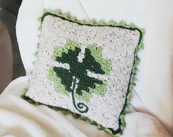 Patrón de almohada de crochet con forma de trébol