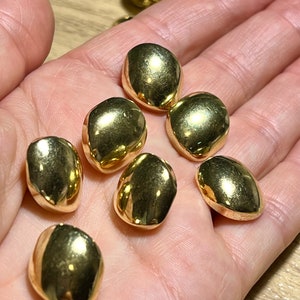 8 x 25mm gold pebble shaped shank buttons. Blazer jacket and coat buttons. R75