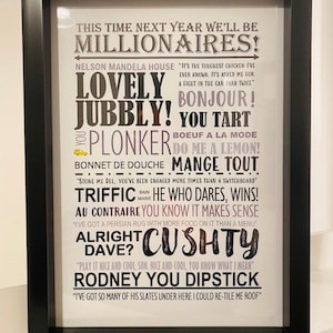May include: Black framed print with various phrases in different fonts and colours, including "Lovely Jubbly!" and "Cushy". The text is set against a white background.
