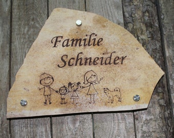 Door sign, name tag, bell sign for the entrance to the house made of stone.  Individual engraving