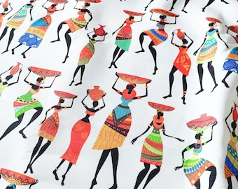 May include: White fabric featuring a repeating pattern of stylised African women. Each figure is in a colourful dress, carrying a basket or jug on their head. The women are in various poses, creating a dynamic design.