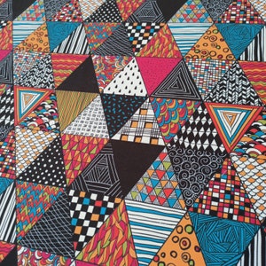 May include: A colorful geometric pattern featuring a patchwork of triangles. Each triangle is filled with unique designs, including stripes, dots, and abstract shapes. The color palette includes black, white, orange, blue, pink, and green.