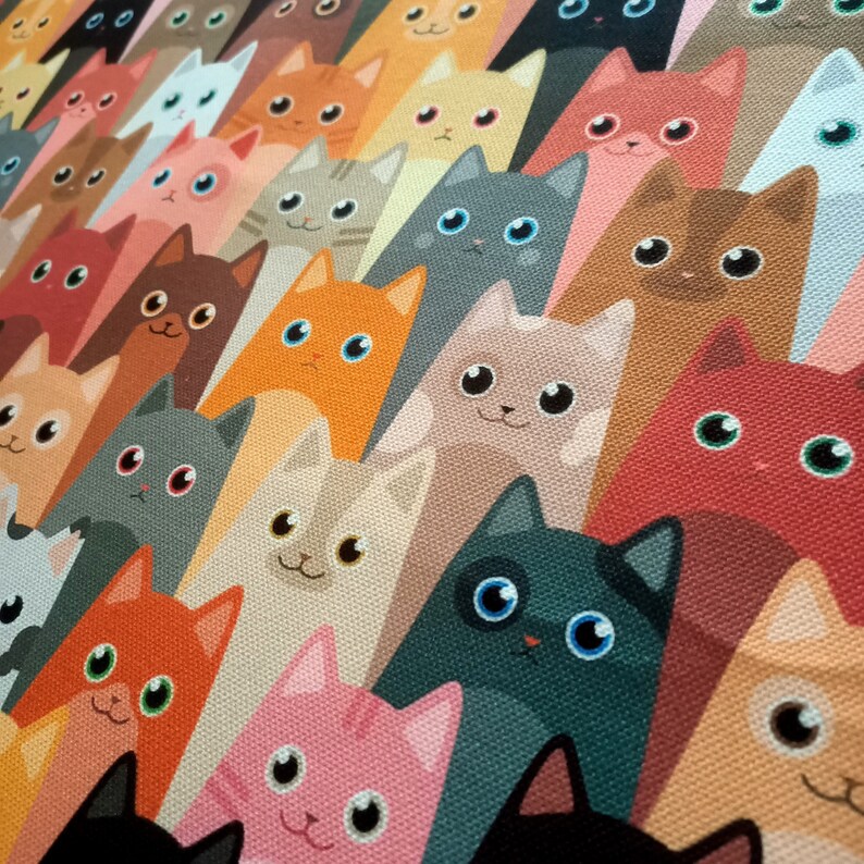 May include: A colorful pattern of cartoon cats with different colored fur and eyes. The cats are arranged in a repeating pattern, with each cat facing forward. The background is a solid color.
