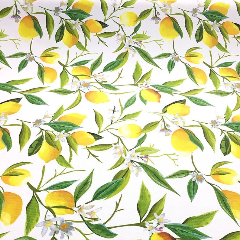 May include: A white background with a repeating pattern of yellow lemons and green leaves. The lemons are arranged in a random pattern and are surrounded by green leaves. The leaves are a darker shade of green than the lemons.