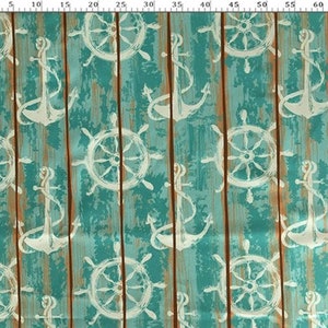 May include: Fabric with a nautical theme. The design features white anchors and ship wheels on a teal background with vertical brown wood grain lines. The numbers 5, 10, 15, 20, 25, 30, 35, 40, 45, 50, 55, 60, and 65 are printed on the fabric.