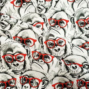 May include: A black and white pattern of monkeys wearing red glasses. The monkeys are drawn in a cartoon style and have different expressions.