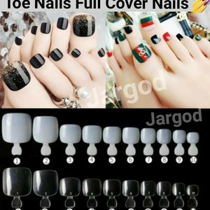 May include: A set of ten clear plastic toe nail tips in various sizes. The tips are arranged in two rows of five, with the numbers 1 through 10 printed below each tip. The tips are designed to be used with nail glue or adhesive to create a natural-looking manicure.