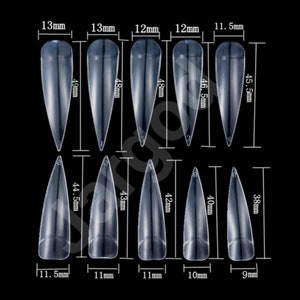 May include: A set of 12 clear plastic stiletto nail tips in various sizes, ranging from 9mm to 13mm in width and 38mm to 49mm in length. The nail tips are arranged in two rows, with the sizes labeled in millimeters.