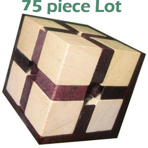 May include: A wooden puzzle cube with a geometric design. The cube is composed of light beige and dark purple wooden blocks. The text "75 piece Lot" is displayed in green at the top of the image.