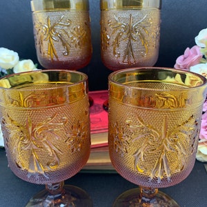 Tiara Exclusives Vintage Amber glass stemmed water glasses.  Set of four