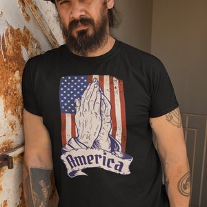 Pray for America Christian T-Shirt | Distressed Flag Shirt | Praying Hands Tshirt for Faithful Patriotism | Patriotic Christian Tee | 5XL