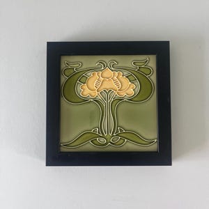 Antique English Framed Art Nouveau green shaped flower pottery tile.