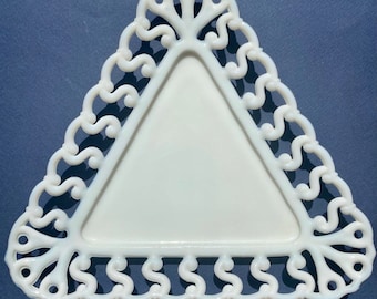 May include: White milk glass triangle shaped trinket dish with a scalloped edge.