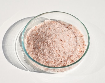 May include: A glass bowl filled with pink Himalayan salt crystals.