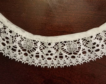46.5 yards of 1" wide, gathered, cream/off white lace