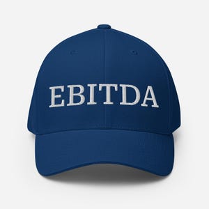 May include: A navy blue baseball cap with the word "EBITDA" embroidered in white on the front.