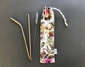 Metal straws with reusable straw pouch. Reusable straws with reusable straw case. Drawstring linen straw bag with stainless steel straws.