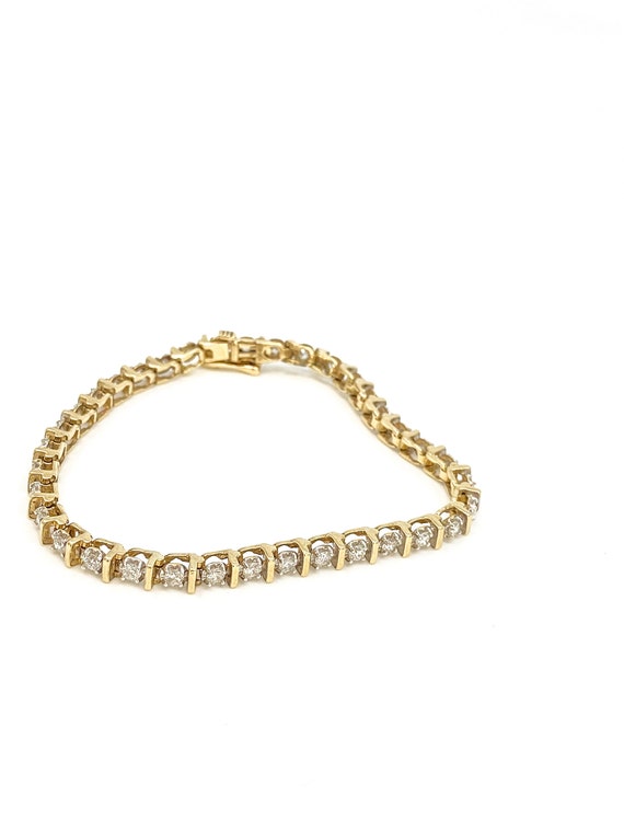 10k gold bracelet from Kay's. Husband got it for me so I would never have  to worry about taking it off. However I just saw the reviews and one person  said the