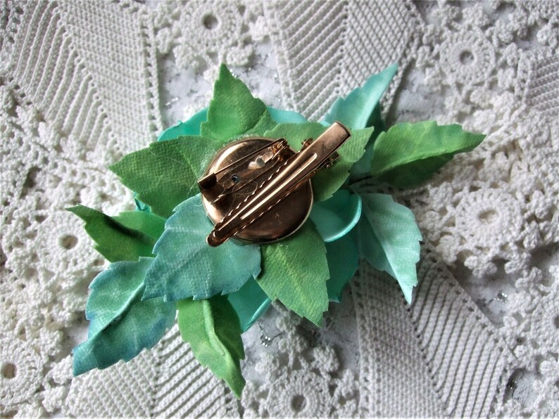 Weightless hair clip on the ribbon of the hat Brooch-clip on the edge of clothing Flower brooch with a turquoise rose Gift for a girl.