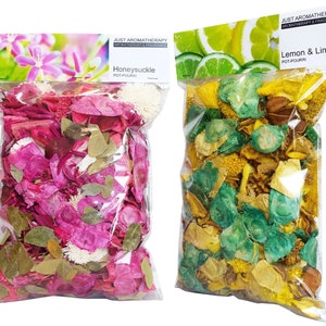 May include: Two bags of potpourri, one with pink and green dried flowers and leaves labelled "Honeysuckle Pot-Pourri" and the other with yellow, green, and brown dried flowers and leaves labelled "Lemon & Lime Pot-Pourri".