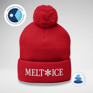 May include: A vibrant red knitted beanie hat with a fluffy pom-pom. The folded brim displays the embroidered words "MELT ICE" with a snowflake design. A winter accessory.