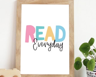 May include: A framed print with the text "READ everyday" in colourful letters. The letters are pink, yellow, blue, and green. The background is white.