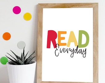 May include: A framed print with a white background and the text "READ everyday" in colourful letters. The letters are red, orange, yellow, and green.