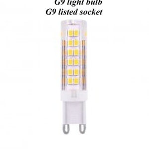 May include: A white G9 light bulb with a clear glass cover and a white plastic base. The bulb has a grid of small, yellow LED lights inside. The text "G9 light bulb" and "G9 listed socket" is printed above the bulb.