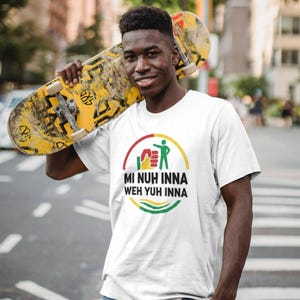 May include: White t-shirt with a circular graphic in red, yellow, and green, featuring the text "MI NUH INNA WEH YUH INNA." A yellow and black skateboard is held over the shoulder. The person is wearing blue jeans.