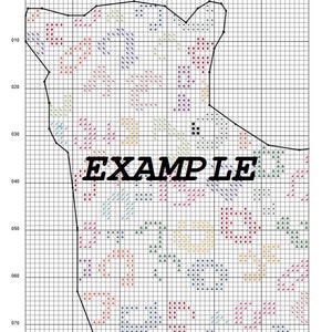 May include: A cross-stitch pattern with a black outline of a shape resembling a bear. The pattern is filled with various colored squares and triangles, including red, blue, green, yellow, and purple.