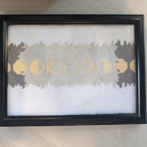 Moon phase completed framed cross stitch