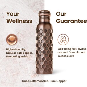 May include: A copper water bottle with a honeycomb pattern. The bottle has a screw-on cap and is made of pure copper. The text on the image says "Your Wellness" and "Our Guarantee".