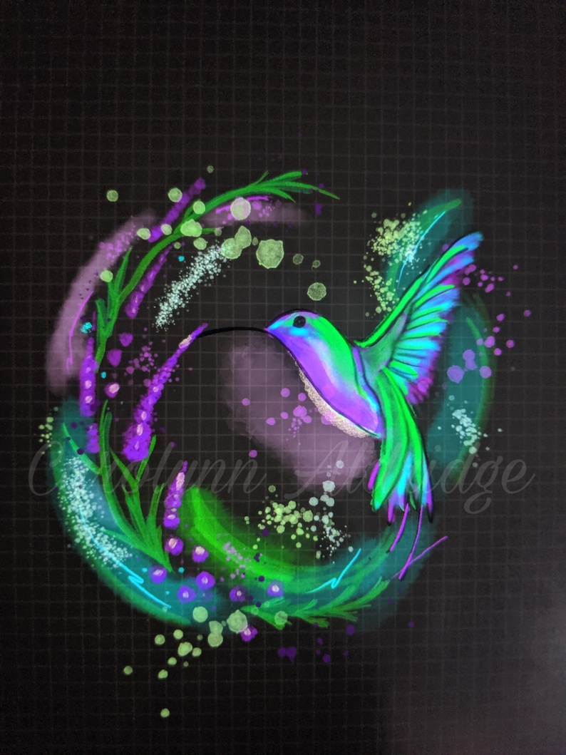 May include: A vibrant green, purple, and blue hummingbird in flight, surrounded by a swirling green and purple floral design on a black background.