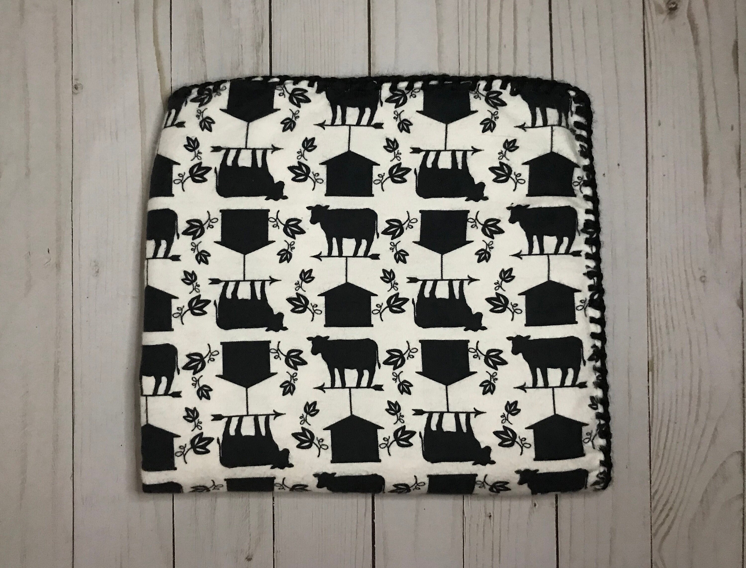 cow print baby grow