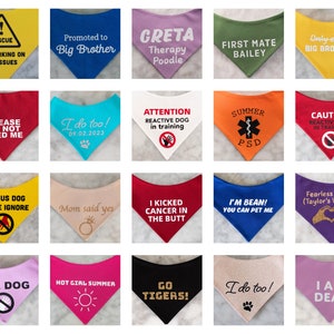 May include: A collection of twenty triangular pet bandanas in various colors including yellow, blue, pink, green, red, orange, white, and black. Each bandana features unique printed text or graphic designs such as warning signs, announcements, and phrases.