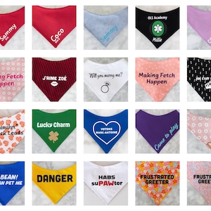 May include: A collection of twenty triangular pet bandanas in various colors and patterns, including solid red, black, blue, yellow, white, and floral prints. Each bandana features custom text, names, or graphic icons like hearts, crowns, and clovers.