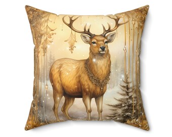 May include: A golden throw pillow with a detailed illustration of a deer in a snowy forest setting. The deer has a golden antler and a golden necklace.
