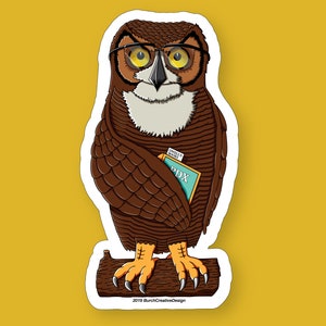 May include: A brown owl wearing glasses and holding a blue and green pamphlet with the text "DWELL'S WORLD" and "PDX". The owl is perched on a brown branch with its claws visible.