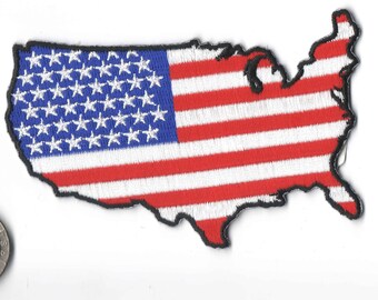May include: An embroidered patch shaped like the United States of America with the American flag design. The patch is red, white, and blue.